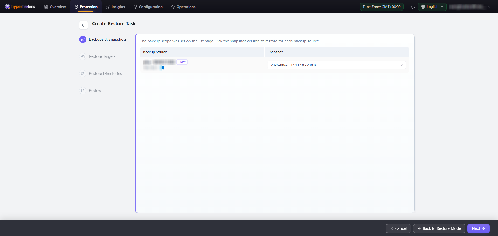 Select the snapshot to restore with the host and IP address blurred while the snapshot time and size remain visible
