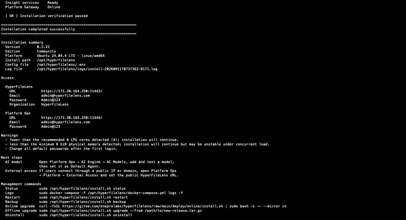 Terminal output after the install script finishes, showing the HyperFileLens and Platform Ops access URLs and the initial email/password